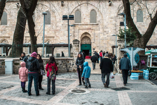 Bursa Grand Mosque or Ulu Cami Bursa, Turkey - February 04, 2017: People are visiting Bursa Grand Mosque or Ulu Cami which is a mosque in Bursa, Turkey ulu camii stock pictures, royalty-free photos & images