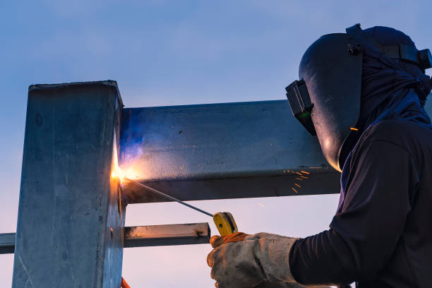 istock Worker welding parts of stell construction 678821440