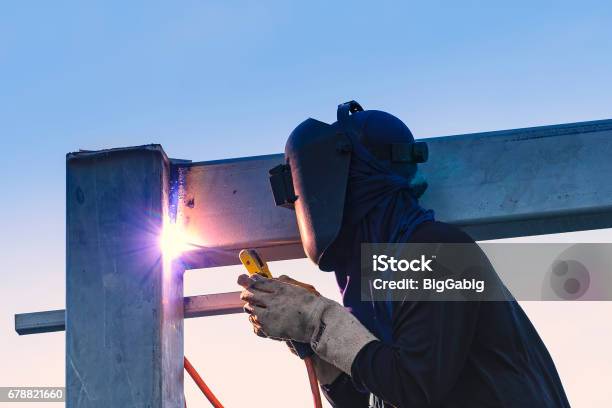 Worker Welding Parts Of Stell Construction Stock Photo - Download Image Now - Metal, Welder, Welding