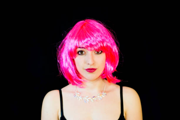 istock Beauty Woman With Pink Wig  over Black Background 678823402