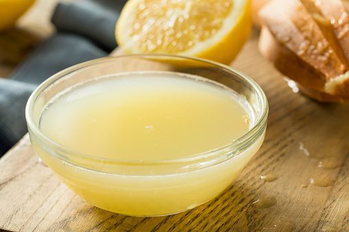 Raw Organic Yellow Lemon Juice in a Bowl