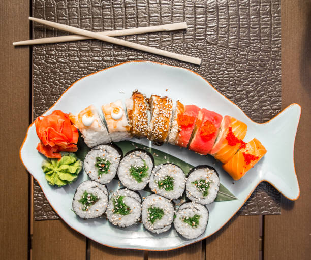 istock Sushi and rolls in a beautiful plate 678836306