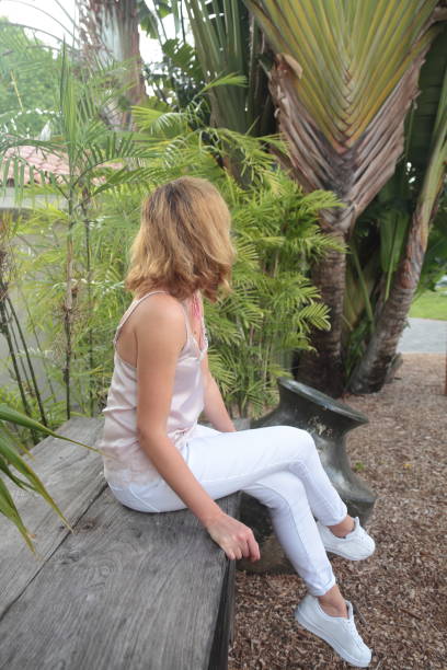 istock Woman in a tropical garden. 678838380