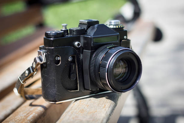 istock Photo camera on a bench in a park 678839192