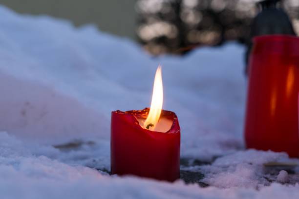 istock Candles in the snow. 678840040
