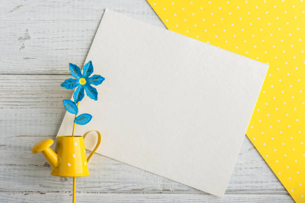 istock Yellow polka dot desk, note and watering can 678847090