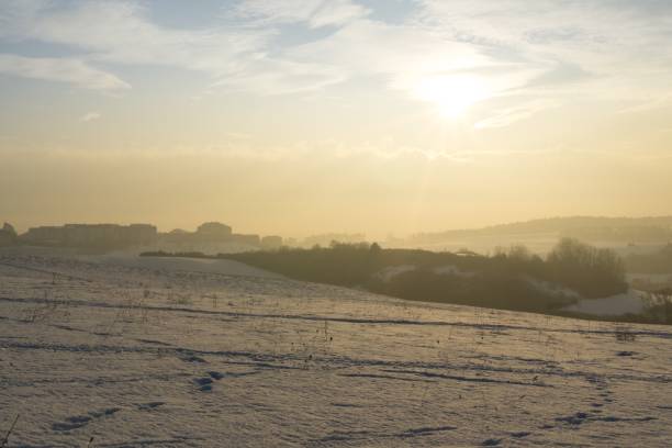 istock Sunrise on meadow covered by snow during winter. 678847944