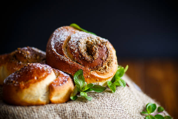 istock Sweet bun with nut filling in powdered sugar 678851582