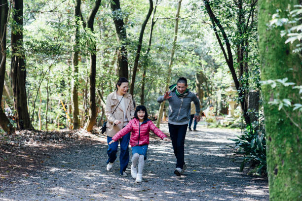 istock Japanese family running together 678853264