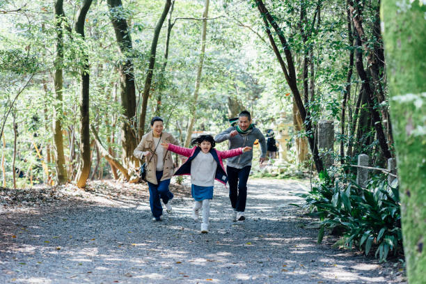 istock Japanese family running together 678853284