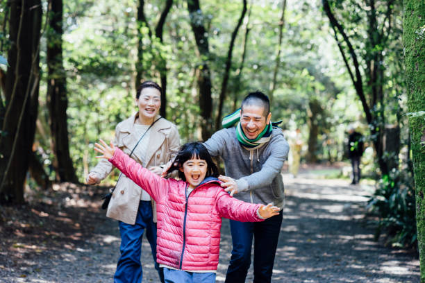 istock Japanese family running together 678853294