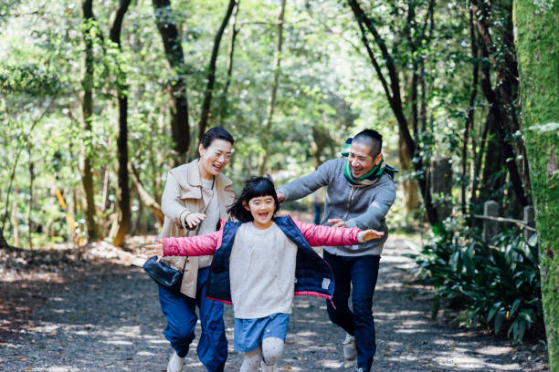 istock Japanese family running together 678853298