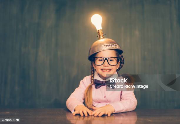 Young Nerd Girl With Thinking Cap Stock Photo - Download Image Now - Child, Contemplation, Intelligence