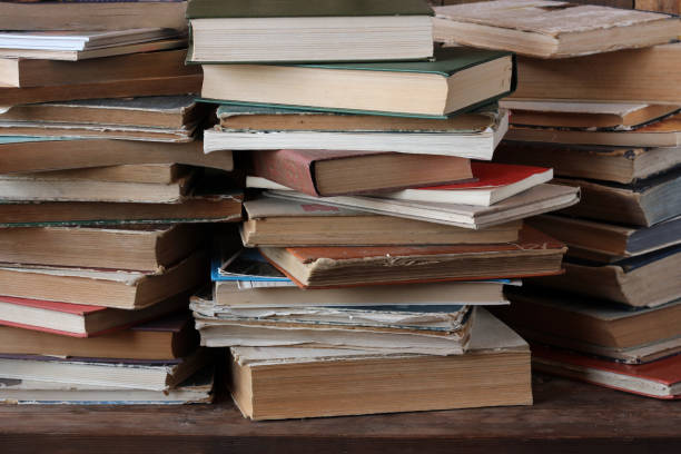 istock the piles of books on the table. 678865428