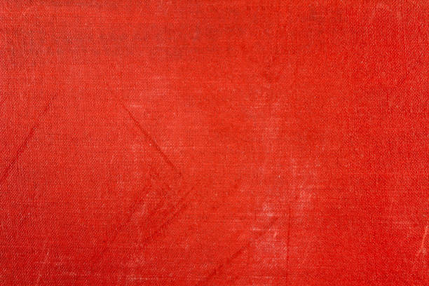 istock Red textile texture with fading and scratches. Abstract background 678867362