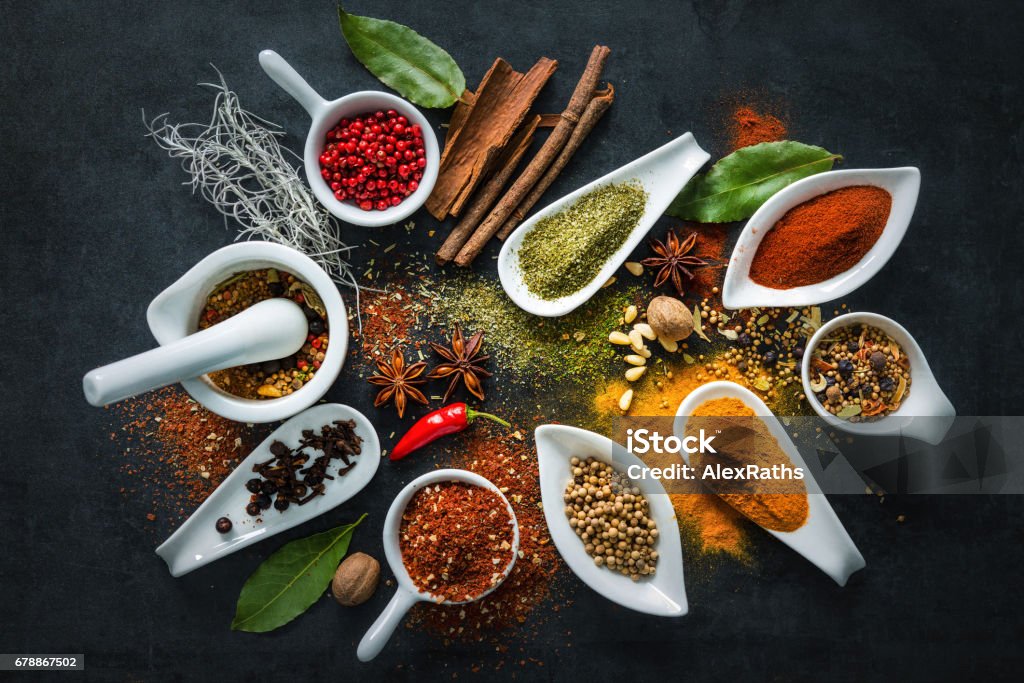 Various herbs and spices Various herbs and spices on black stone plate Spice Stock Photo