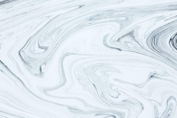 istock Mix of a white and black paint, closeup. 678870080