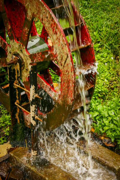 istock Red Watermill pouring water 678878346