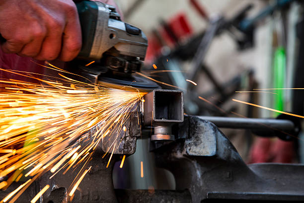 istock Midsection Man Grinding Metal In Factory 678880127