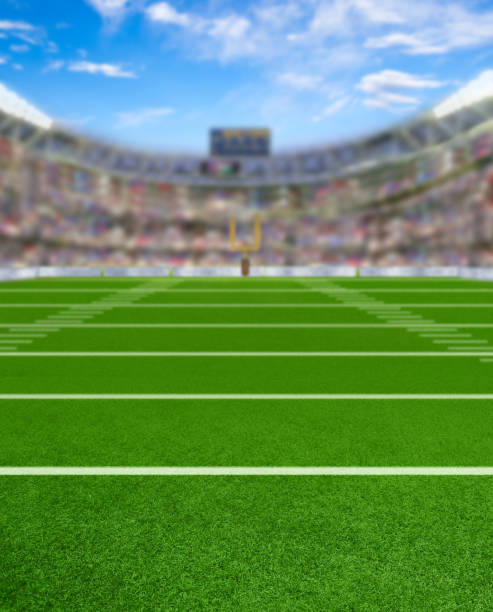 3D Rendered Football Stadium With Copy Space 3D rendered American football stadium full of fans in the stands with copy space. Deliberate focus on foreground and shallow depth of field on background. bleachers photos stock pictures, royalty-free photos & images