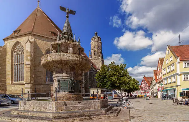 Urban life and view of a fountain on the main square of Nordlingen
