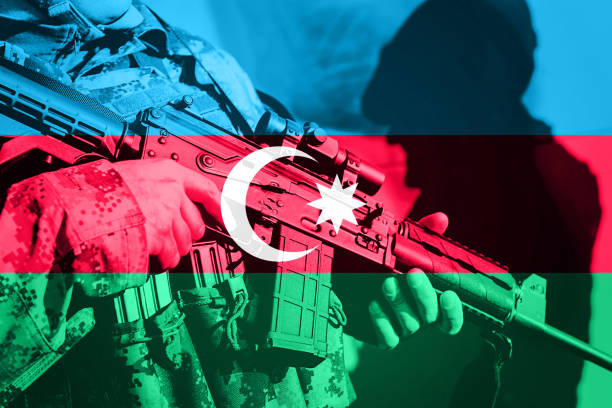 Soldier with machine gun with national flag of Azerbaijan Soldier with machine gun with national flag of Azerbaijan azerbaijan stock pictures, royalty-free photos & images