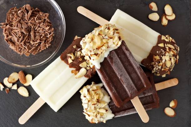 istock Chocolate and almond ice pops overhead scene against slate 678933570