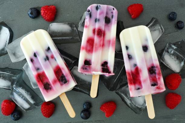 istock Mixed berry yogurt popsicles on a slate background 678933812