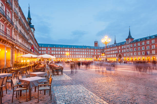 Plaza Mayor in Madrid Spain Stock photograph of  Plaza Mayor, a large historic- square in central Madrid, Spain illuminated at twilight blue hour. madrid stock pictures, royalty-free photos & images
