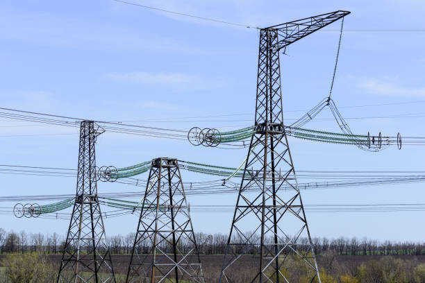 istock High-voltage power lines against the blue sky. 678935564