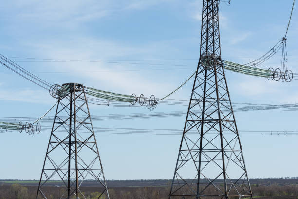 istock High-voltage power lines against the blue sky. 678935586