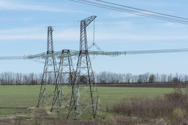 istock High-voltage power lines against the blue sky. 678935590
