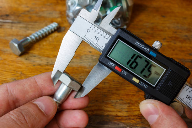 istock Measurement of the bolt head with an electronic caliper 678940668