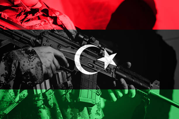 istock Soldier with machine gun with national flag of Libya 678966224