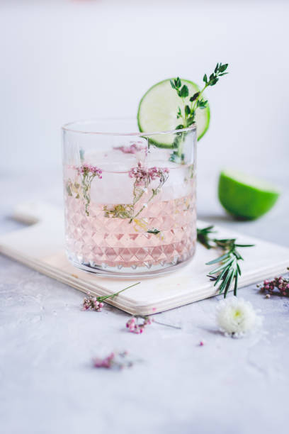 istock natural cocktail with herbs and cut lime on stone desk background 678966278