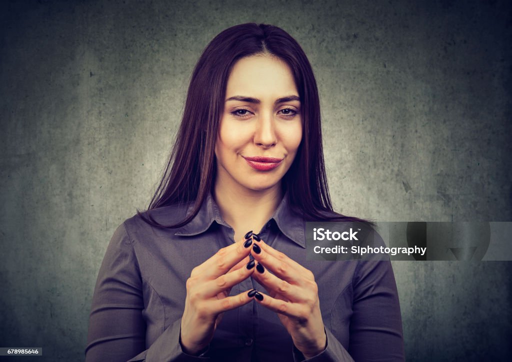 woman looking with sly expression, having good idea Let me think. Attractive woman looking with sly expression, having good idea One Woman Only Stock Photo