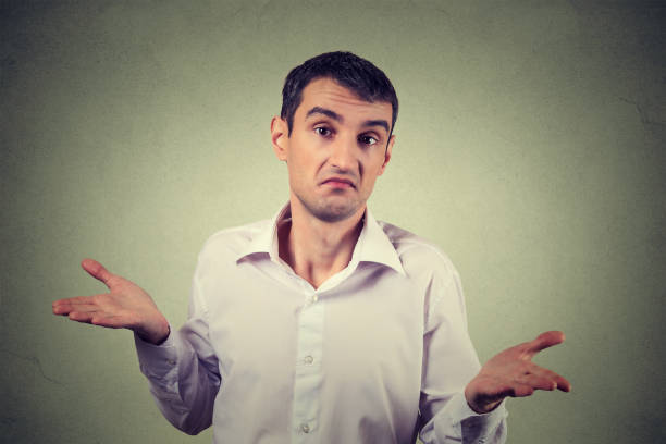 istock young upset man shrugging shoulders who cares so what I don't know gesture 678987426