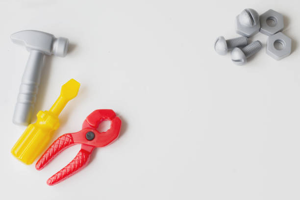 istock Children's plastic toy. Children's tool. hammer, pliers, screwdriver on a white background 678998038