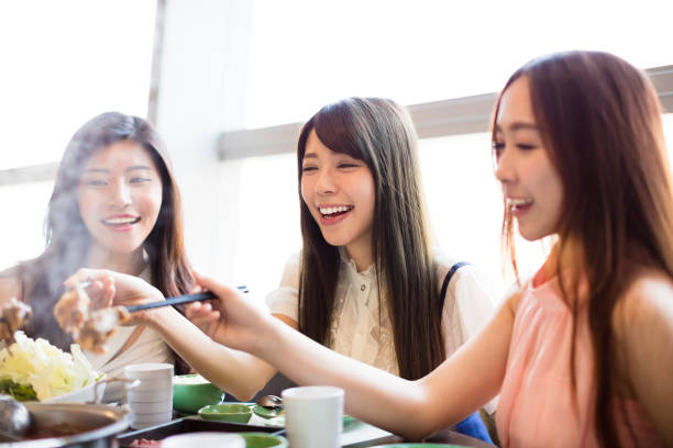 istock happy young Women group  Eating hot pot 679090668