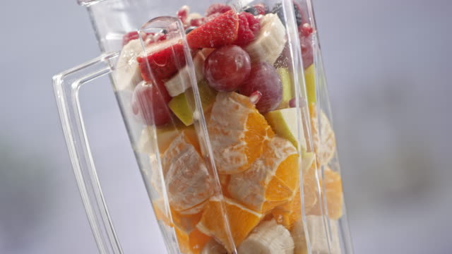 SLO MO LD Blender jar with fruit rotating on table