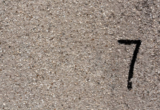 istock Number seven on gray gruhge wall surface. 679196306