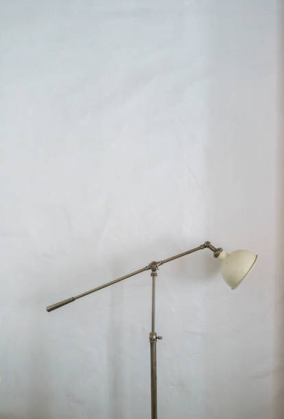 istock Metal lamp stand on white wall 679199000