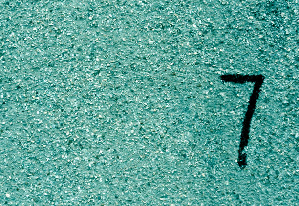istock Number seven on cyan grunge wall surface. 679201492