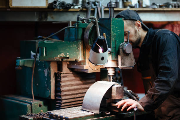 istock Workshop Worker Drilling Metal Parts 679207378