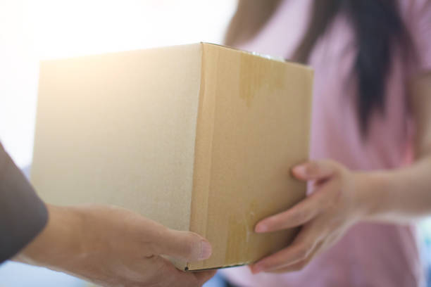 istock Woman hand accepting a delivery of boxes 679219470