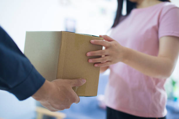 istock Woman hand accepting a delivery of boxes 679219752
