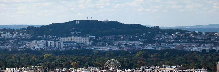 Panoramic view of the Bois de Boulogne with in the foreground, Paris and in the background, the 162 meters high Mont-Valérien in Suresnes (Hauts-de-Seine) with on it, the Forteresse du Mont-Valérien and the Suresnes American Cemetery.