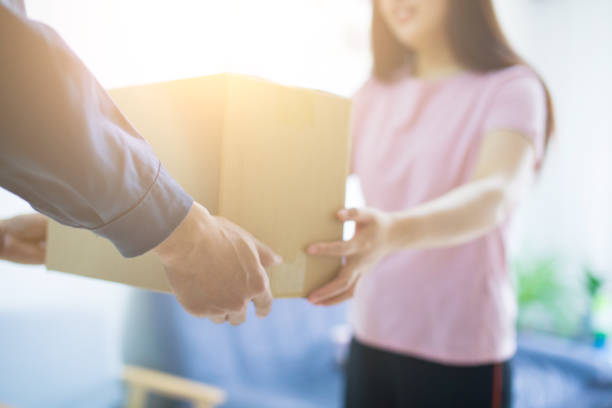 istock Woman hand accepting a delivery of boxes 679223448