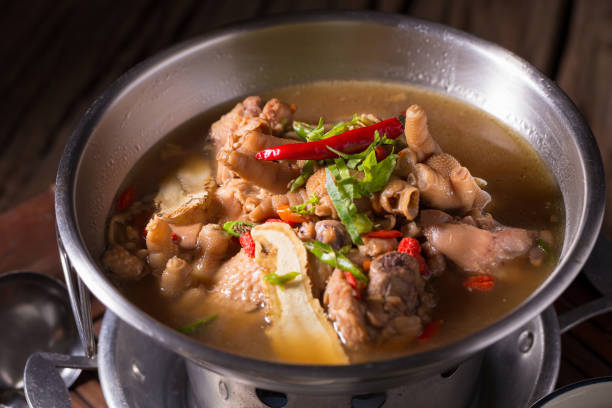 istock Chicken and herb soup in pot 679225112