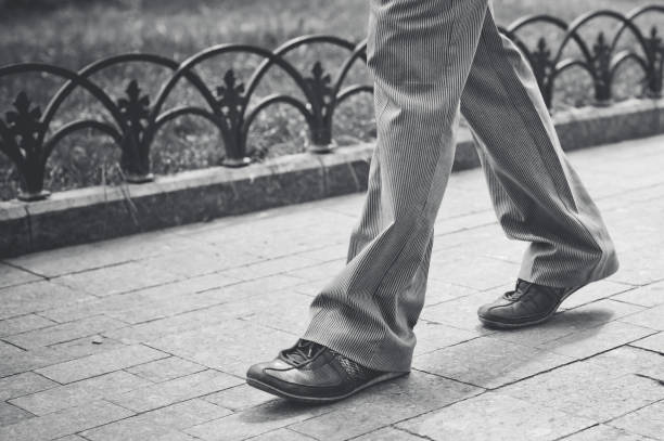 A man is walking in the park